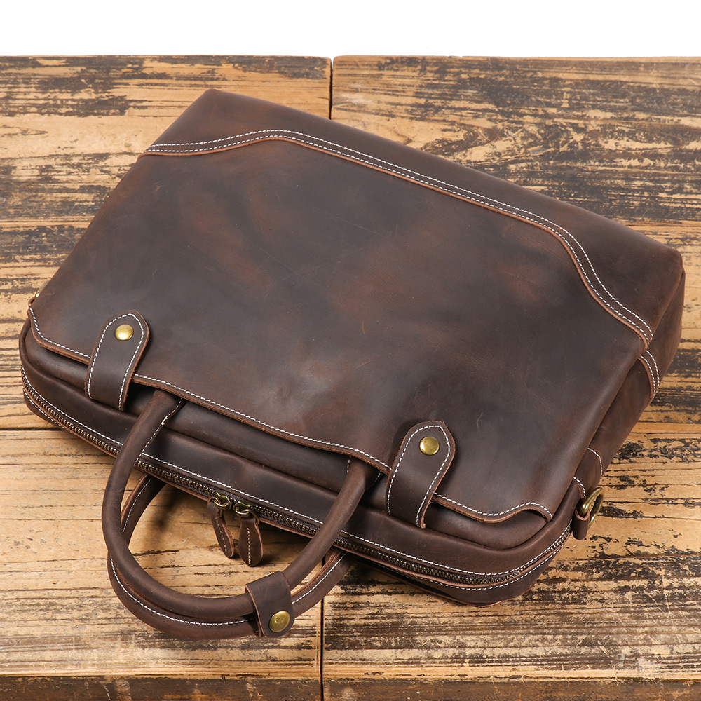 Dark brown men's laptop case, front pocket detail