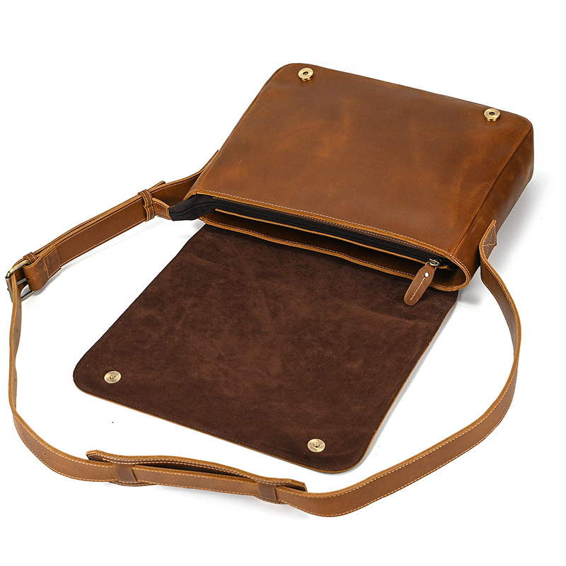 Brown men's messenger bag, flap open with strap