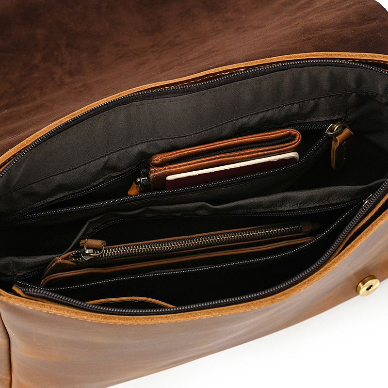 Man wearing the brown leather messenger bag