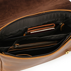 Man wearing the brown leather messenger bag