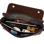 Dark brown men's messenger bag, interior packed with laptop and items