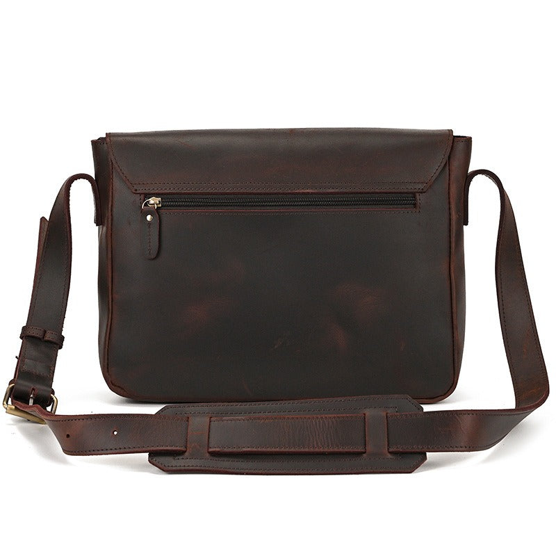 Dark brown men's messenger bag, back view with zip pocket