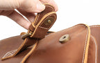 Man wearing the brown leather messenger bag