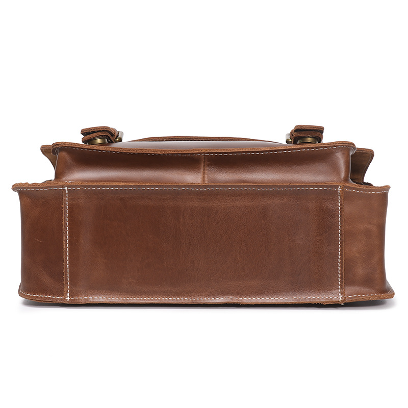 Dark brown men's messenger bag, side view