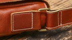 Brown men's messenger bag, front view