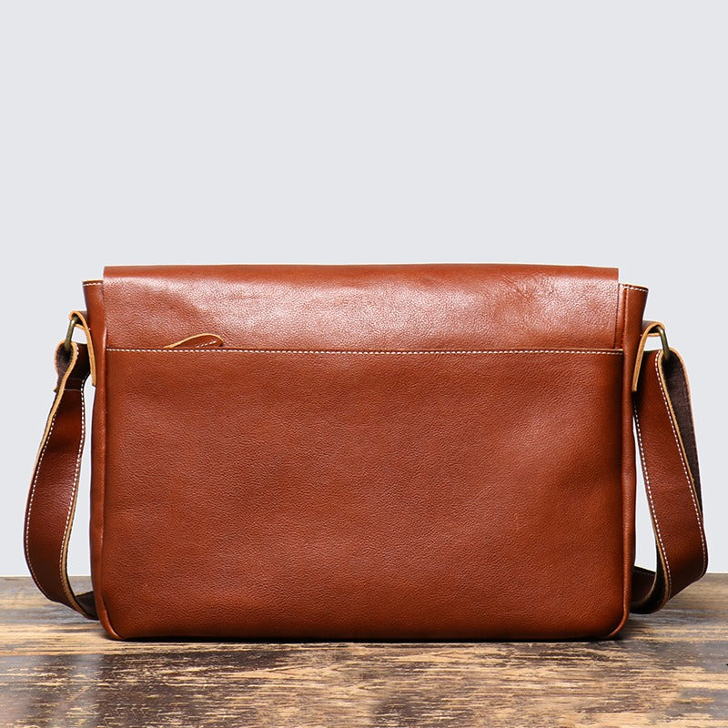 Brown men's messenger bag, strap buckle detail