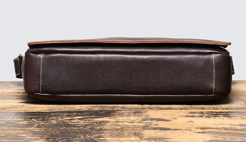 Dark brown men's messenger bag, bottom view