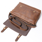 Man wearing the dark brown leather messenger bag