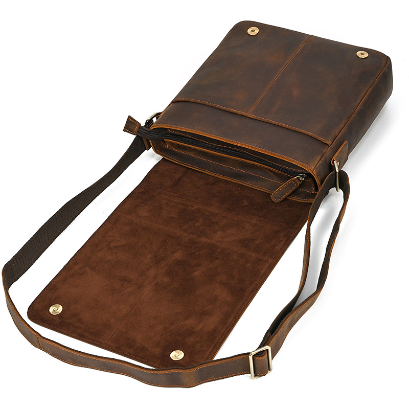 Dark brown men's messenger bag, interior view with flap open