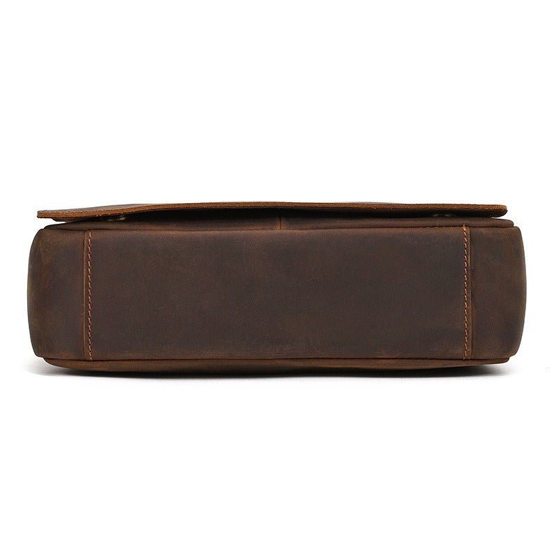 Dark brown men's messenger bag, bottom view