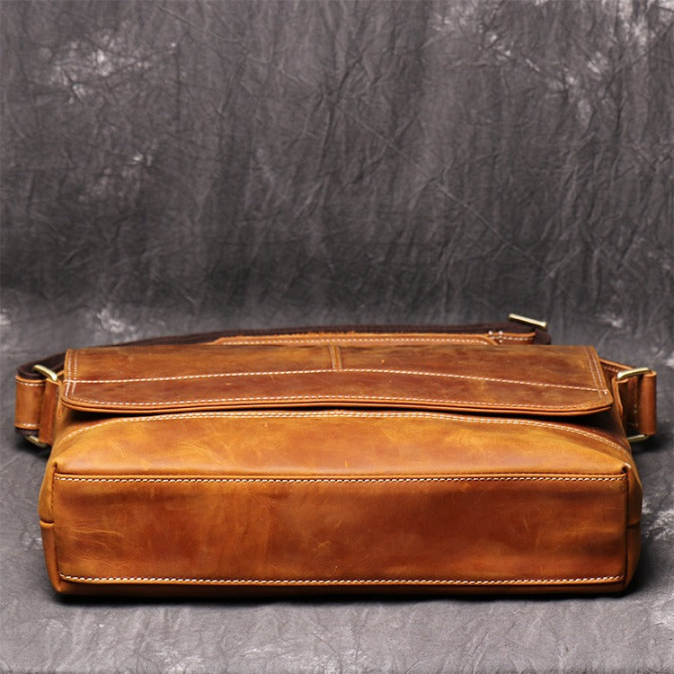 Brown men's messenger bag, flat lay