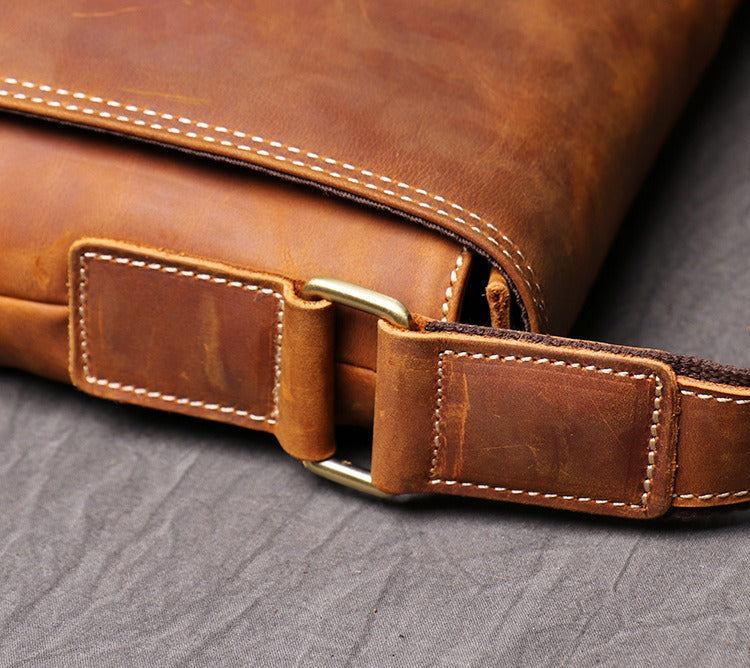 Man wearing the brown leather messenger bag