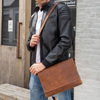 Man wearing the brown leather messenger bag