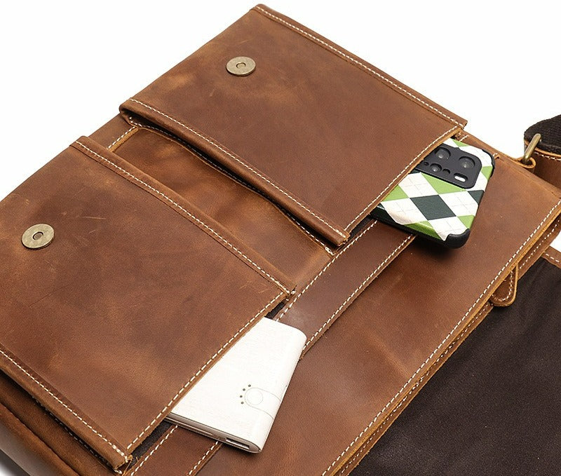 Brown men's messenger bag, interior pockets with accessories