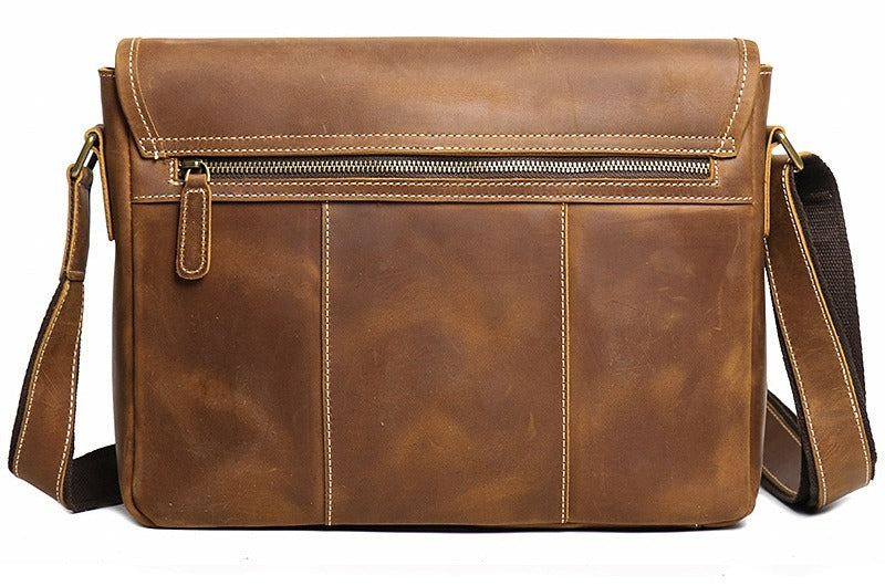 Man wearing the brown leather messenger bag