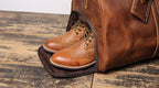 Brown men's oversized duffle bag, shoe compartment detail
