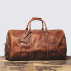 Brown men's oversized duffle bag, strap detail
