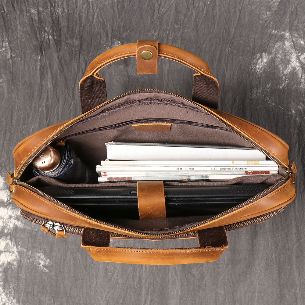 Brown men's satchel, front pocket detail