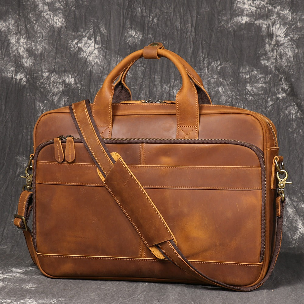 Brown men's satchel, handle detail