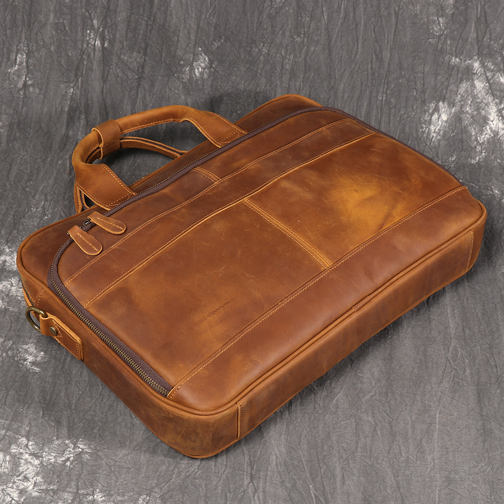 Brown men's satchel, strap detail