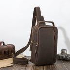 Dark brown men's sling backpack, side view