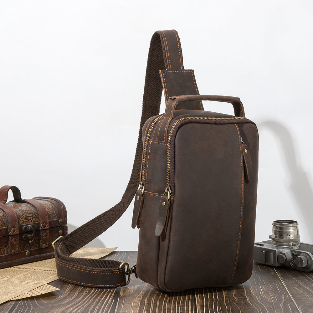 Dark brown men's sling backpack, side view