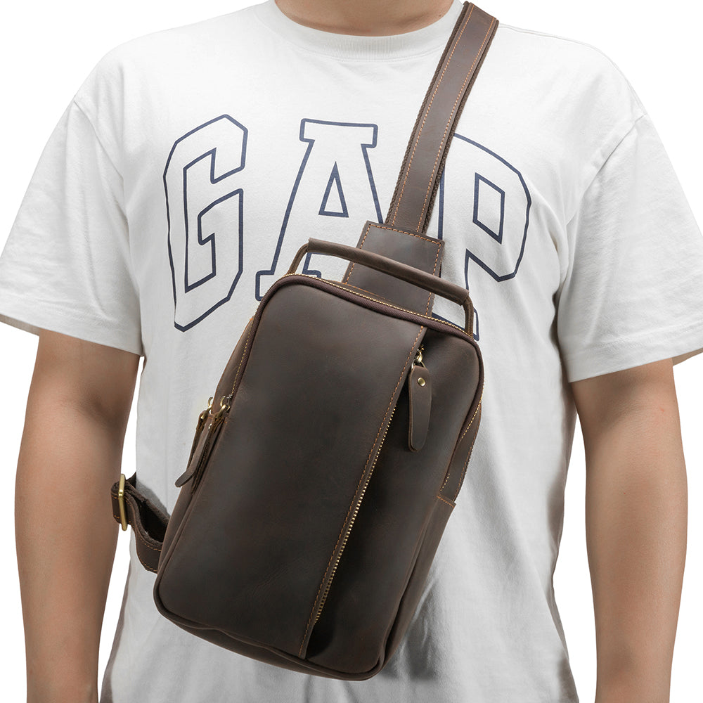 Dark brown men's sling backpack, front pocket detail