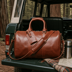 Brown men's duffle bag on a mountain dock
