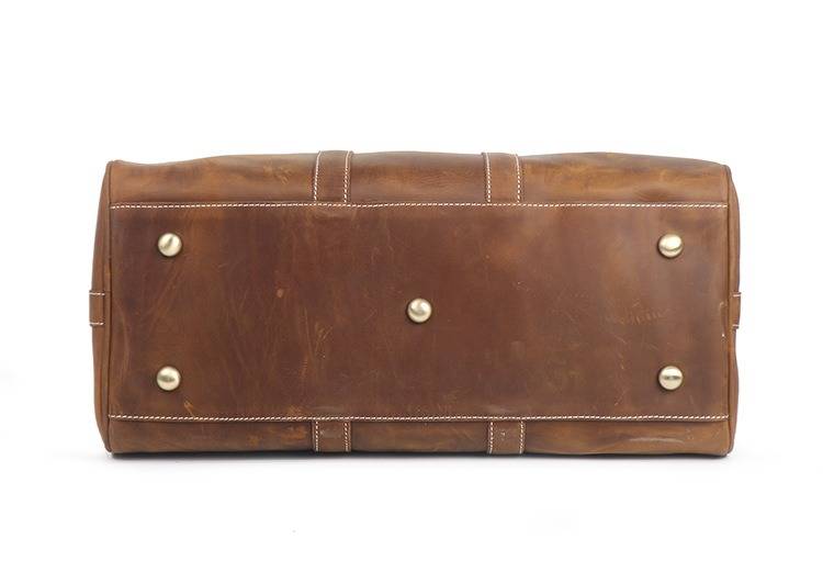 Vintage brown men's duffle bag, flat lay