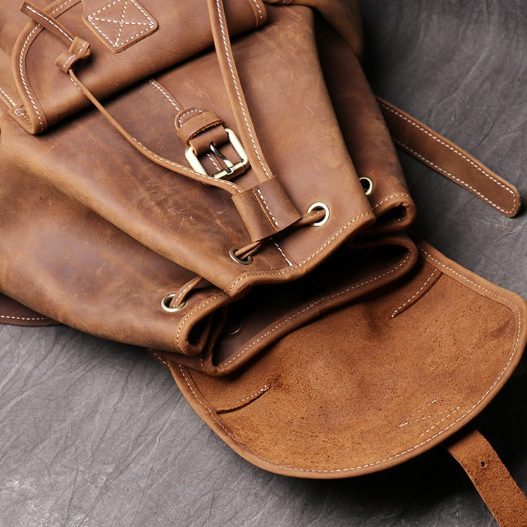 Brown men's travel backpack, side view