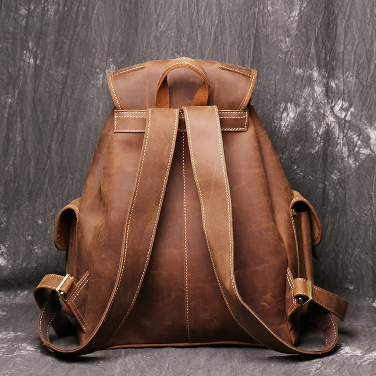 Brown men's travel backpack, back panel detail