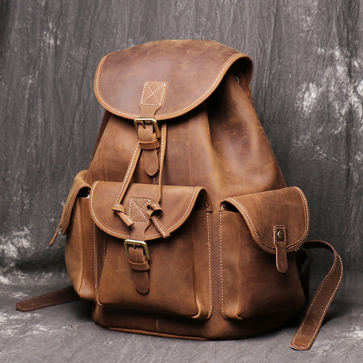 Brown men's travel backpack, back view
