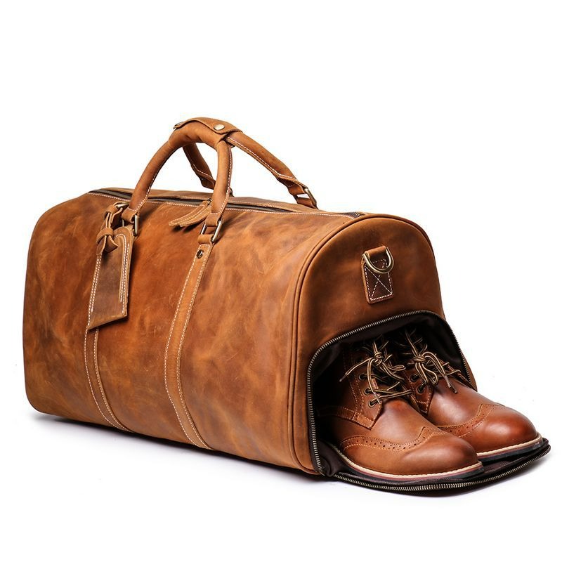Brown men's travel bag, strap detail