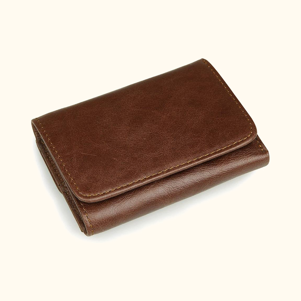 Brown men's trifold wallet, flat lay