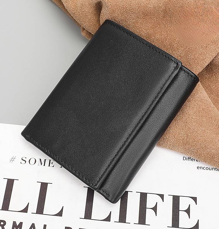 Black men's trifold wallet, flat lay