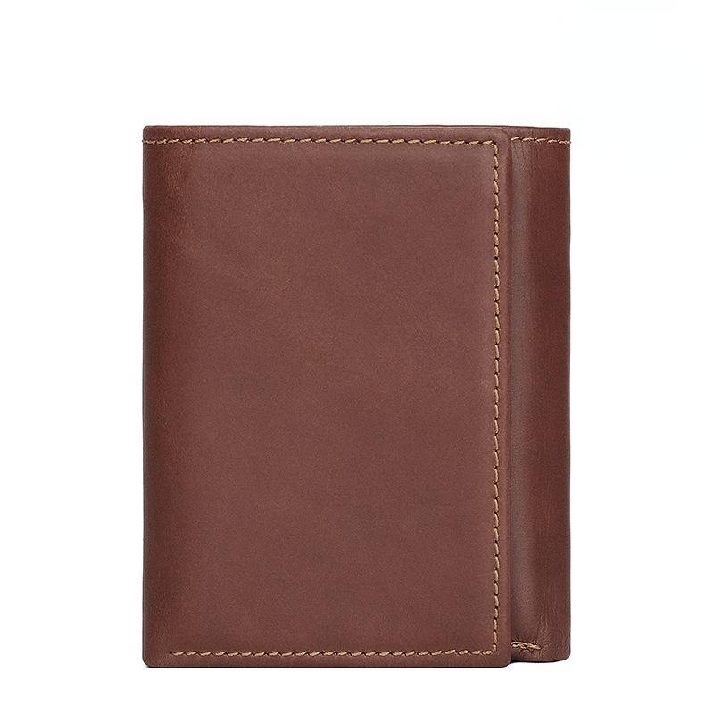 Man holding the brown trifold wallet