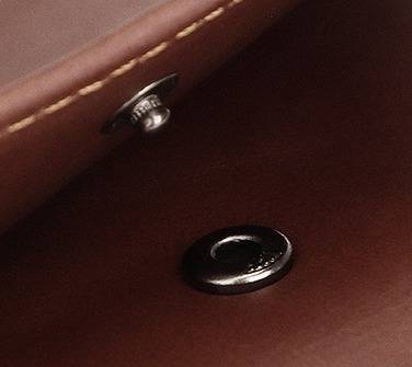 Dark brown men's trifold wallet, closed view