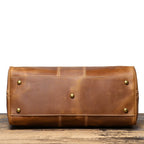 Brown men's weekend bag, tablet sleeve detail