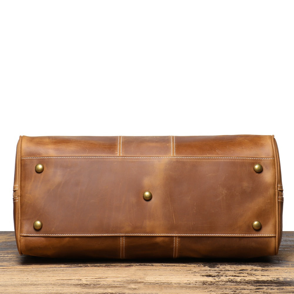 Brown men's weekend bag, tablet sleeve detail