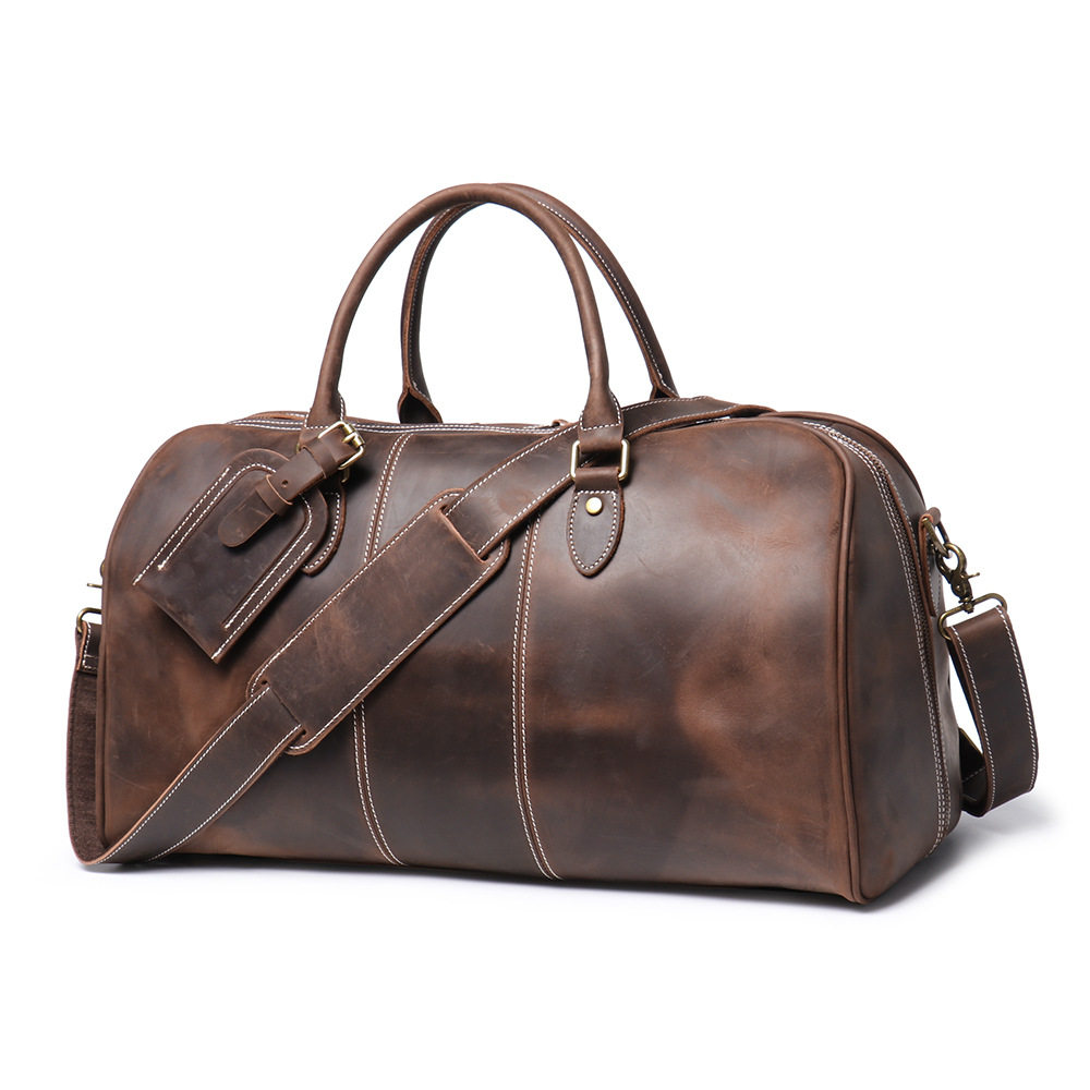 Dark brown men's weekend bag, tablet sleeve detail
