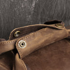 Brown men's weekender bag, handle detail