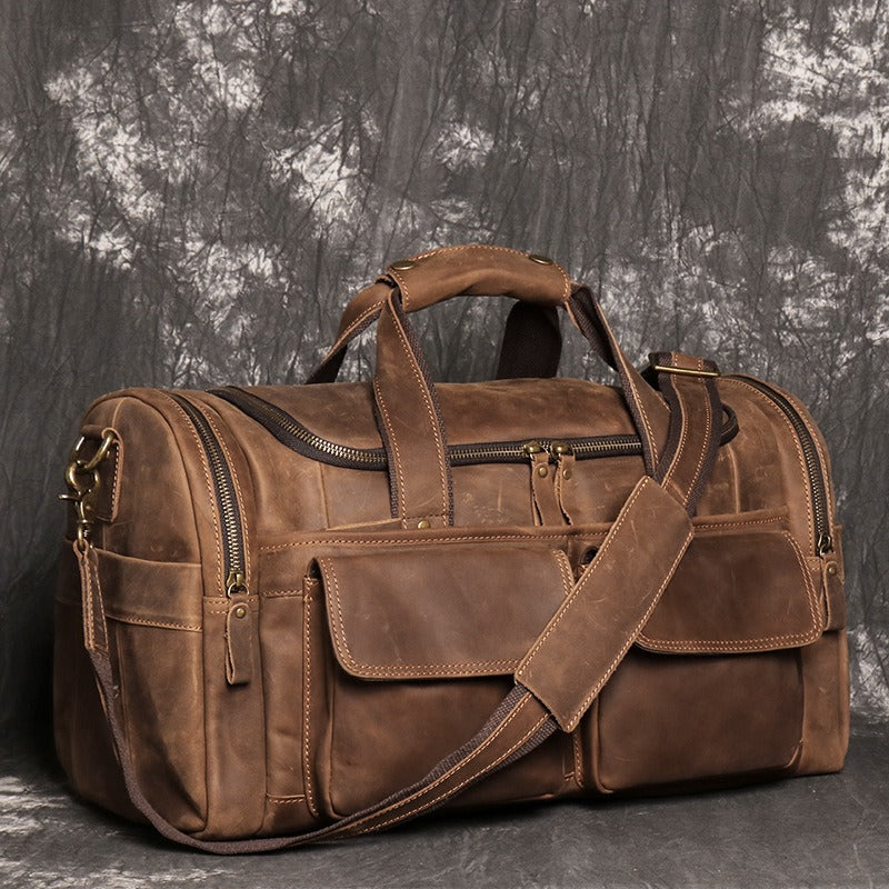Brown men's weekender bag, bottom feet detail
