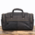 Vintage black men's weekender bag, side view