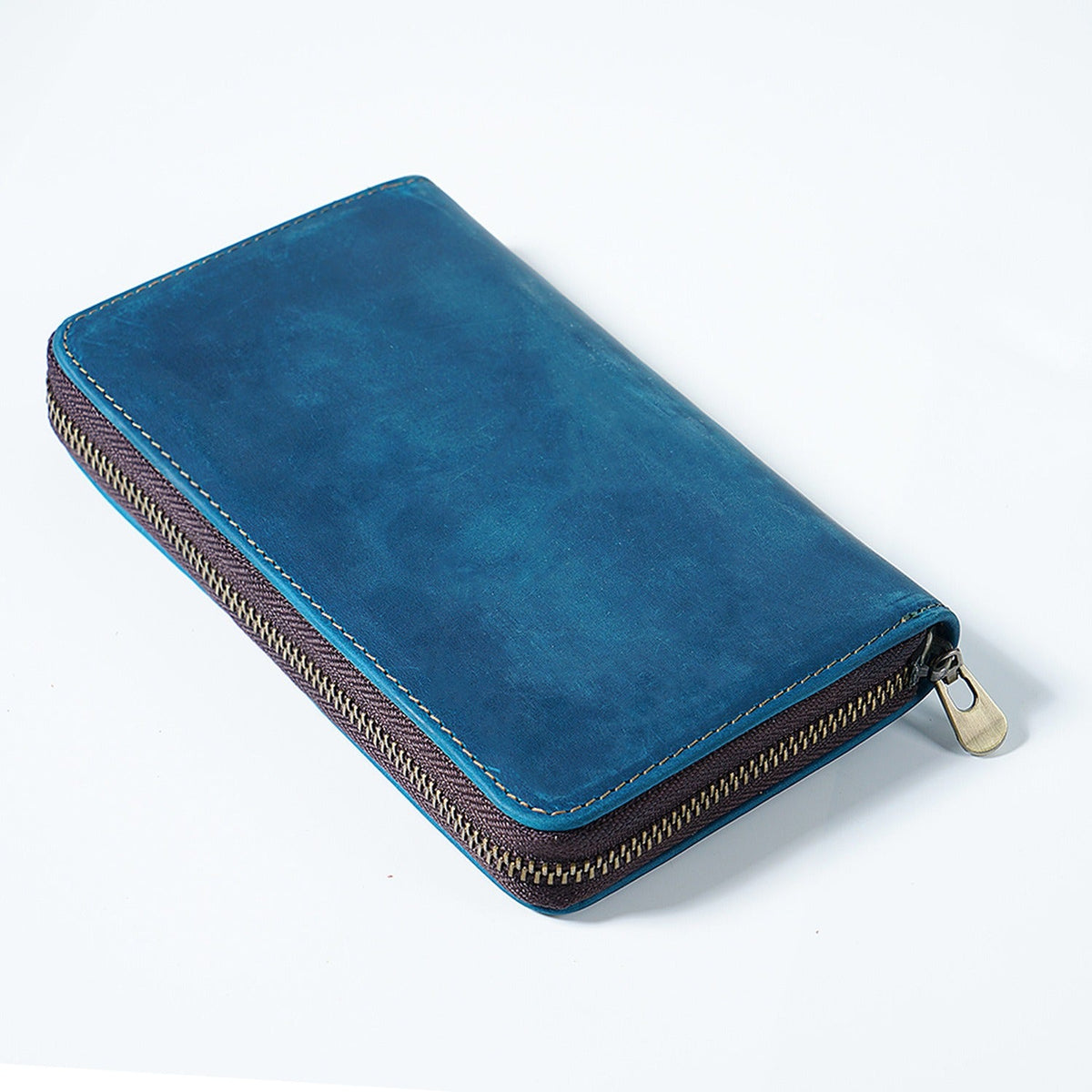 Blue leather book-fold pen organizer case