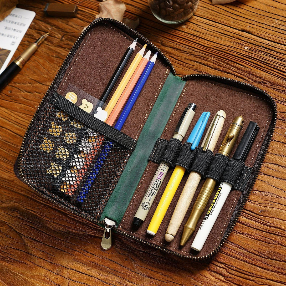 Brown leather book-fold pen organizer case