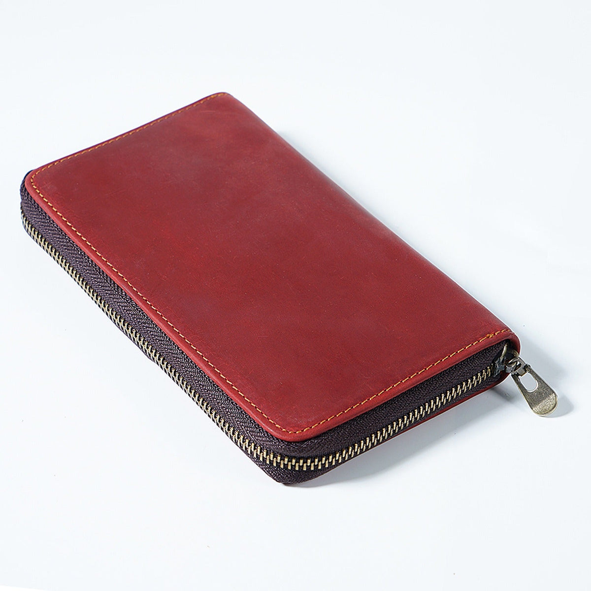 Red leather book-fold pen organizer case