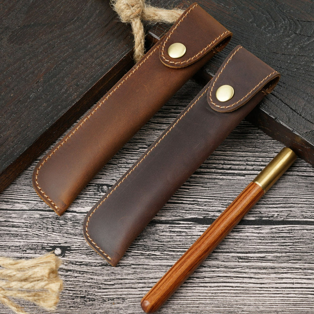 Brown leather single pen sleeve with snap closure