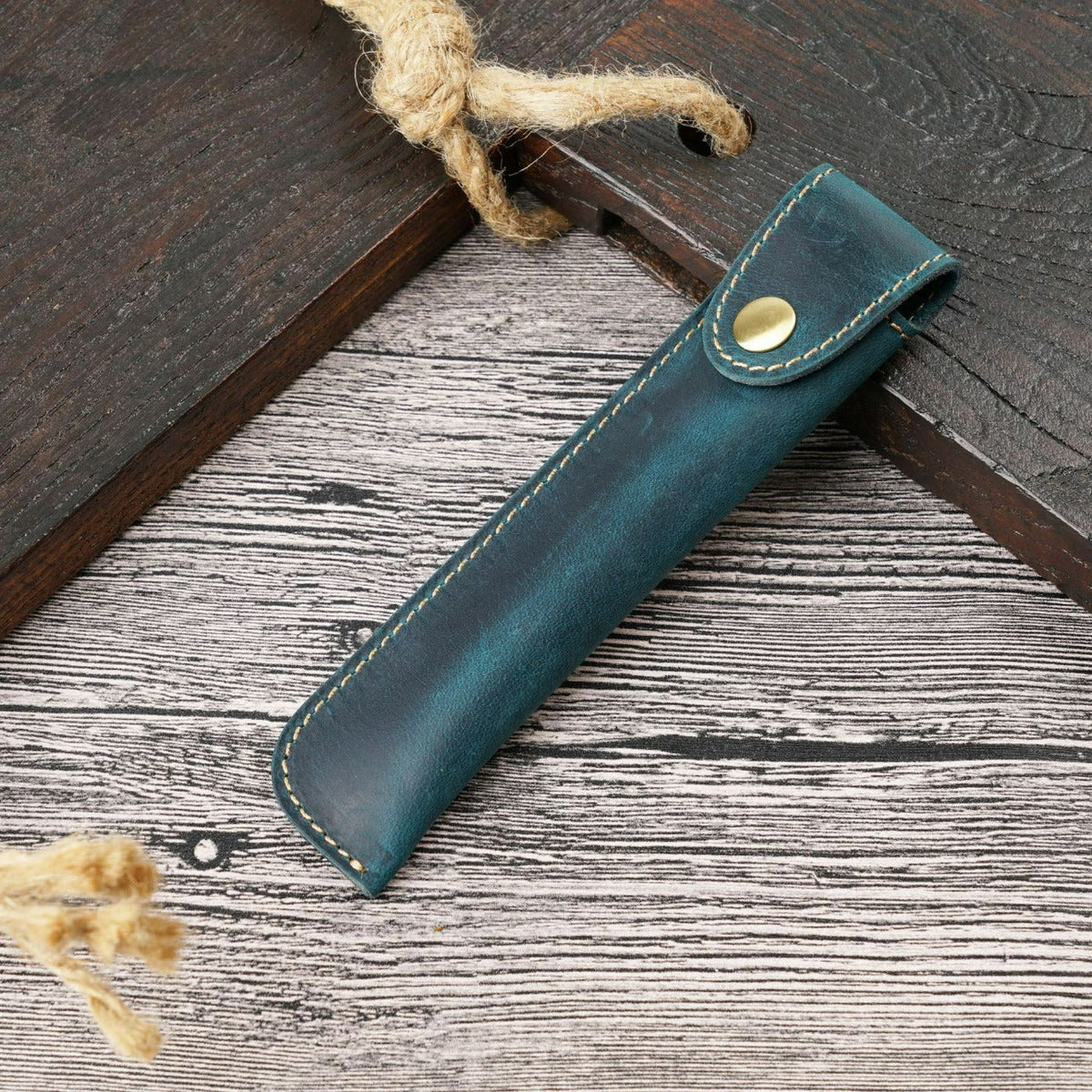 Navy leather pen sleeve with brass snap