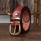 Red men's leather belt buckle close-up