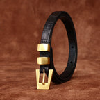 Black women's belt, coiled view